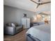 Main bedroom featuring a sitting area, dresser and a partial view into the bathroom at 4304 W Calle Poco --, Laveen, AZ 85339