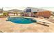 Enjoy a private backyard with a large pool, diving board, and covered patio perfect for outdoor entertaining at 4304 W Calle Poco --, Laveen, AZ 85339