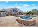 Backyard features a shimmering pool, spa, and spacious travertine patio at 4304 W Calle Poco --, Laveen, AZ 85339