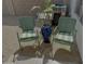 Back yard area with pair of chairs, water feature, and inspirational sign at 4925 W Bluefield Ave, Glendale, AZ 85308