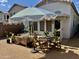 Charming backyard with gravel, shade umbrella, and dining set, creating a great outdoor space at 4925 W Bluefield Ave, Glendale, AZ 85308
