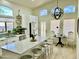 Sunlit kitchen with stainless appliances, island, and a breakfast nook at 4925 W Bluefield Ave, Glendale, AZ 85308