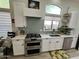 Well-equipped kitchen featuring modern appliances, light backsplash, and ample cabinet space at 4925 W Bluefield Ave, Glendale, AZ 85308