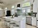 Bright kitchen with a large island, stainless steel appliances, and modern finishes at 4925 W Bluefield Ave, Glendale, AZ 85308