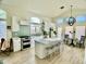 Bright, modern kitchen with stainless steel appliances, island, and eat in area at 4925 W Bluefield Ave, Glendale, AZ 85308