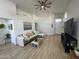 Bright living room with vaulted ceilings, neutral decor, and wood floors at 4925 W Bluefield Ave, Glendale, AZ 85308