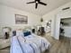 Comfortable main bedroom with a ceiling fan and ensuite bathroom with a double sink vanity at 4925 W Bluefield Ave, Glendale, AZ 85308