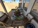 Covered patio with outdoor seating, flowers, and a view of the backyard at 4925 W Bluefield Ave, Glendale, AZ 85308