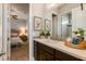 Bright bathroom featuring tiled walls, white countertops, and a stylish vanity at 5085 S Ponderosa Dr, Gilbert, AZ 85298