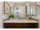 Well-lit bathroom with vanity featuring mosaic backsplash and decor at 5085 S Ponderosa Dr, Gilbert, AZ 85298