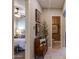 Inviting hallway featuring neutral tones, decor, and glimpses into the bedroom and bathroom at 5085 S Ponderosa Dr, Gilbert, AZ 85298