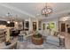 Open concept living room showcasing an expansive layout with elegant furnishings and views into the kitchen at 5085 S Ponderosa Dr, Gilbert, AZ 85298