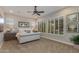 Serene main bedroom with neutral tones, plush bedding, and shuttered windows offering ample natural light at 5085 S Ponderosa Dr, Gilbert, AZ 85298