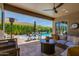 Comfortable outdoor space with a wicker sectional, ceiling fan, and a view of the pool at 5085 S Ponderosa Dr, Gilbert, AZ 85298