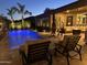 Inviting outdoor patio with comfortable seating area next to a sparkling pool, ideal for relaxing and entertaining guests at 5085 S Ponderosa Dr, Gilbert, AZ 85298