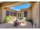 Relaxing outdoor patio featuring comfortable seating, a unique center table, and ample natural light at 5085 S Ponderosa Dr, Gilbert, AZ 85298