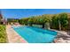 Lush backyard oasis with a sparkling pool and outdoor seating area at 5085 S Ponderosa Dr, Gilbert, AZ 85298