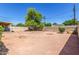 Large backyard with gravel, decorative firepit areas, potential for landscaping and personalized design at 548 W Linda Ln, Chandler, AZ 85225