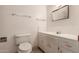 Bathroom featuring a toilet, vanity, and mirror at 548 W Linda Ln, Chandler, AZ 85225