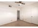 Bedroom featuring neutral carpet, a ceiling fan, and a closet at 548 W Linda Ln, Chandler, AZ 85225