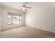 Bright bedroom with a large window providing natural light and neutral walls at 548 W Linda Ln, Chandler, AZ 85225