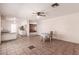 Open dining area with tile flooring, a table, and seamless access to the kitchen at 548 W Linda Ln, Chandler, AZ 85225