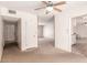 Hallway with neutral walls, carpet flooring, and doorways leading to other rooms at 548 W Linda Ln, Chandler, AZ 85225