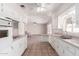 Bright kitchen features tile floors, white cabinets and countertops, and a ceiling fan at 548 W Linda Ln, Chandler, AZ 85225