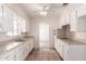 Well-lit kitchen featuring white cabinets, tile flooring, and stainless-steel appliances at 548 W Linda Ln, Chandler, AZ 85225