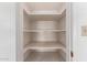 This walk-in pantry has built-in shelves for ample storage space at 548 W Linda Ln, Chandler, AZ 85225