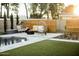 Beautiful backyard with a pool, fire pit, lounge seating, and manicured grass creating a serene outdoor retreat at 5541 E Cheery Lynn Rd, Phoenix, AZ 85018