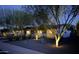 Well-lit, single story home with mature trees, xeriscaping and modern design elements creating curb appeal at 5541 E Cheery Lynn Rd, Phoenix, AZ 85018