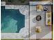 Aerial view of a modern pool with stone surround, two chairs and a lounger, and a fire pit seating area at 5541 E Cheery Lynn Rd, Phoenix, AZ 85018