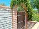 Charming gate adorned with climbing vines adding character and privacy to the property at 6139 E Voltaire Ave, Scottsdale, AZ 85254