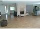 Open concept living room with fireplace, hardwood floors and white trim at 6139 E Voltaire Ave, Scottsdale, AZ 85254