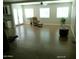 Spacious living room with hardwood floors, bright windows, and a comfortable sitting area at 6139 E Voltaire Ave, Scottsdale, AZ 85254