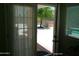 View of patio through open french doors at 6139 E Voltaire Ave, Scottsdale, AZ 85254