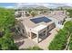 Aerial view of home featuring large covered patio and solar panels, plus mountain views at 6781 W Lone Cactus Dr, Glendale, AZ 85308