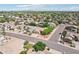 Aerial view of a neighborhood featuring well-manicured lawns and houses with tile roofs at 6781 W Lone Cactus Dr, Glendale, AZ 85308