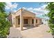 Covered patio and beautiful flagstone area provides a relaxing outdoor living space at 6781 W Lone Cactus Dr, Glendale, AZ 85308