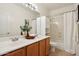 Bathroom features double sinks, cabinetry, and shower with tub combo at 6781 W Lone Cactus Dr, Glendale, AZ 85308