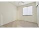 Bedroom with standard closet includes carpeted floor and bright window at 6781 W Lone Cactus Dr, Glendale, AZ 85308
