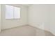 Clean bedroom design includes plush carpet and a bright window view at 6781 W Lone Cactus Dr, Glendale, AZ 85308