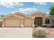 A well-maintained home with a three-car garage, desert landscaping, and a tile roof at 6781 W Lone Cactus Dr, Glendale, AZ 85308
