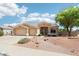 Charming home with a three-car garage, desert landscaping, and a tile roof at 6781 W Lone Cactus Dr, Glendale, AZ 85308