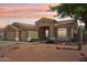 Charming single-story home with a well-manicured desert landscape and neutral color palette at 6781 W Lone Cactus Dr, Glendale, AZ 85308