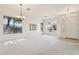 Spacious living room with lots of natural light and neutral-toned carpet at 6781 W Lone Cactus Dr, Glendale, AZ 85308