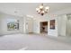 Expansive living room offers carpeted floors and a view to front entry at 6781 W Lone Cactus Dr, Glendale, AZ 85308