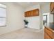 Bonus room features built-in wood cabinetry and carpeted floors at 6781 W Lone Cactus Dr, Glendale, AZ 85308