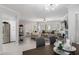 Bright living room with tile floors, comfortable seating, a fireplace, and access to the outdoors at 7575 E Indian Bend Rd # 1142, Scottsdale, AZ 85250